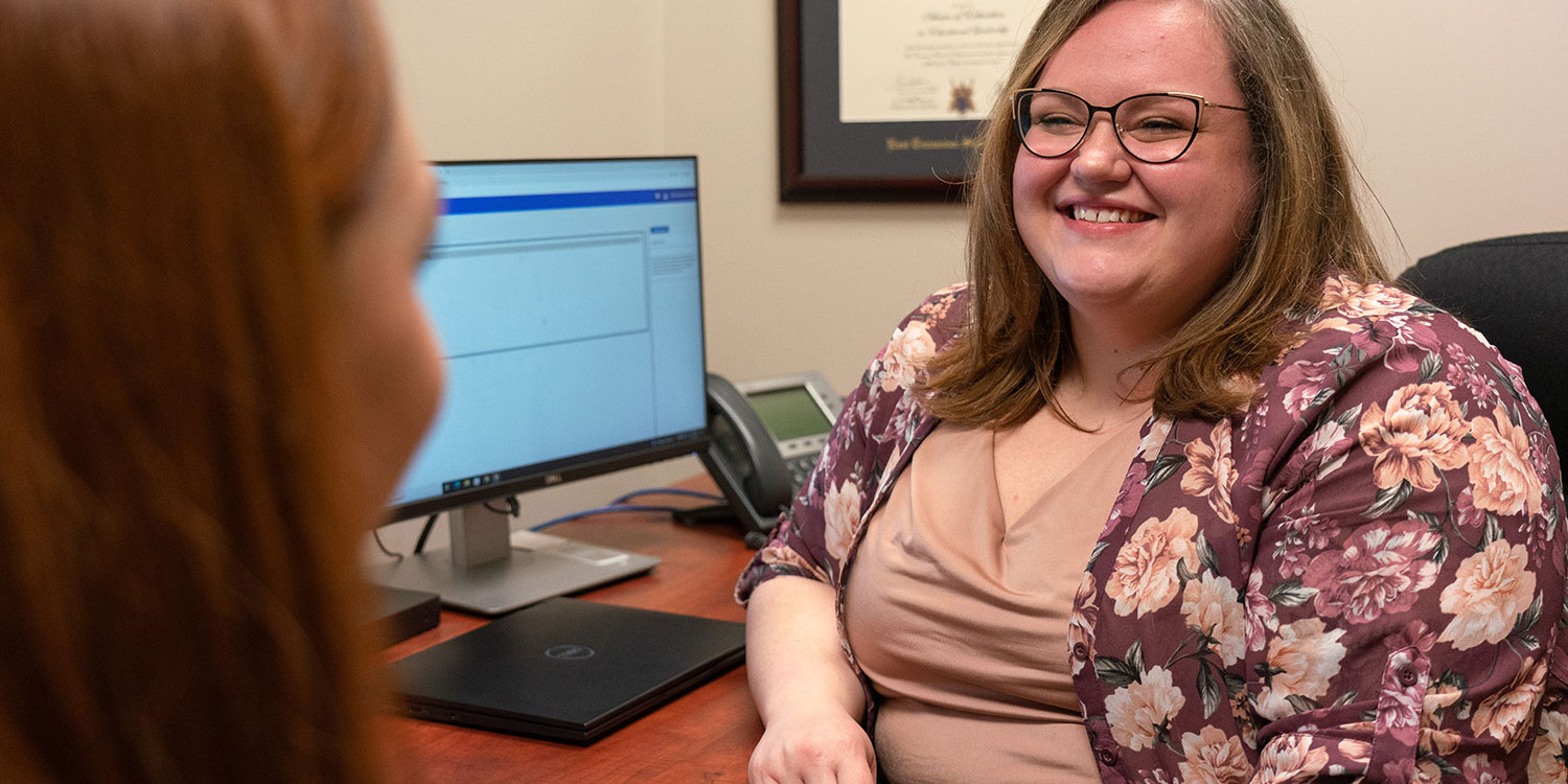 An advisor talking to a student.