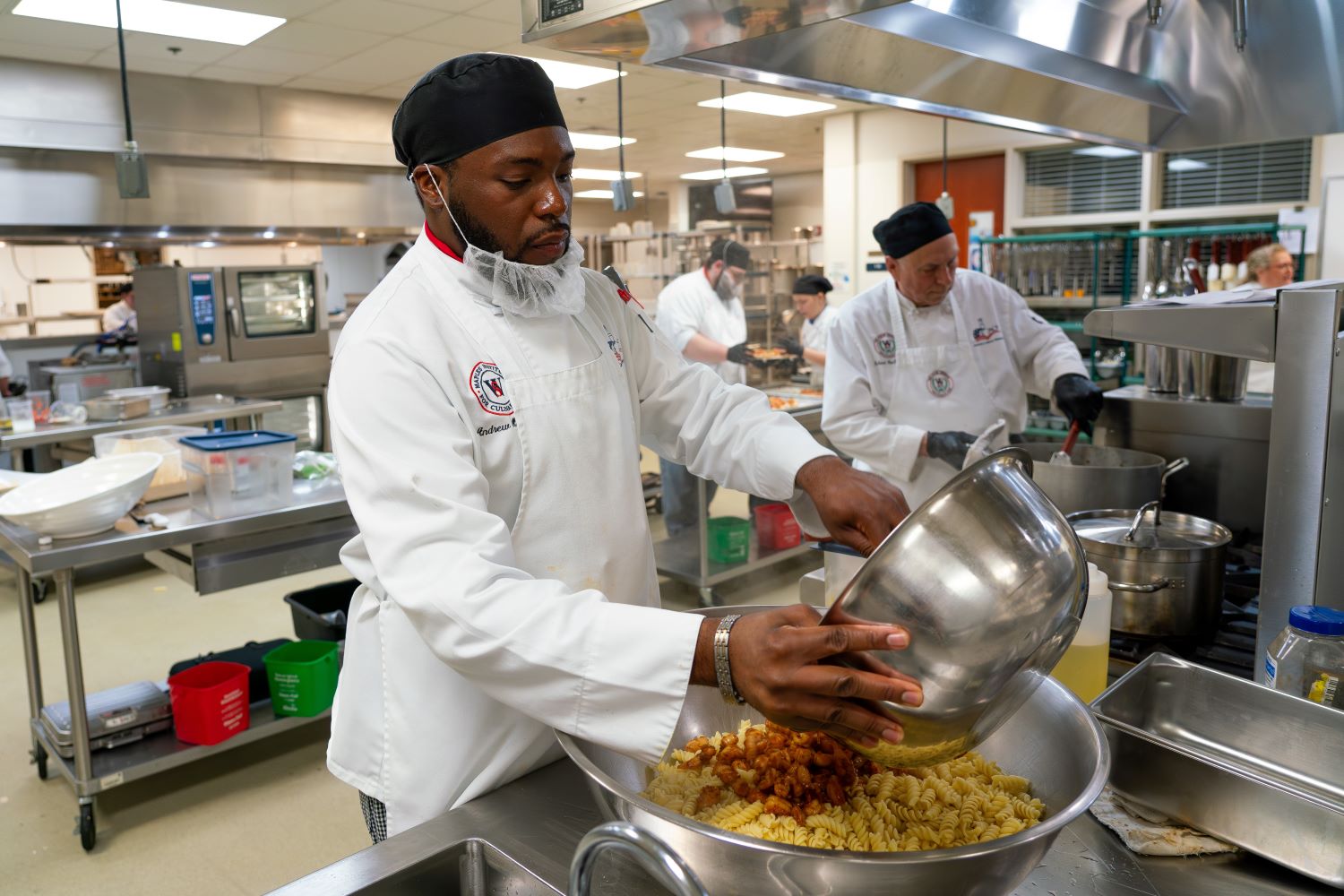 A man preparing food at the Maples Institute for Culinary Arts